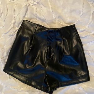 Black faux leather shorts
